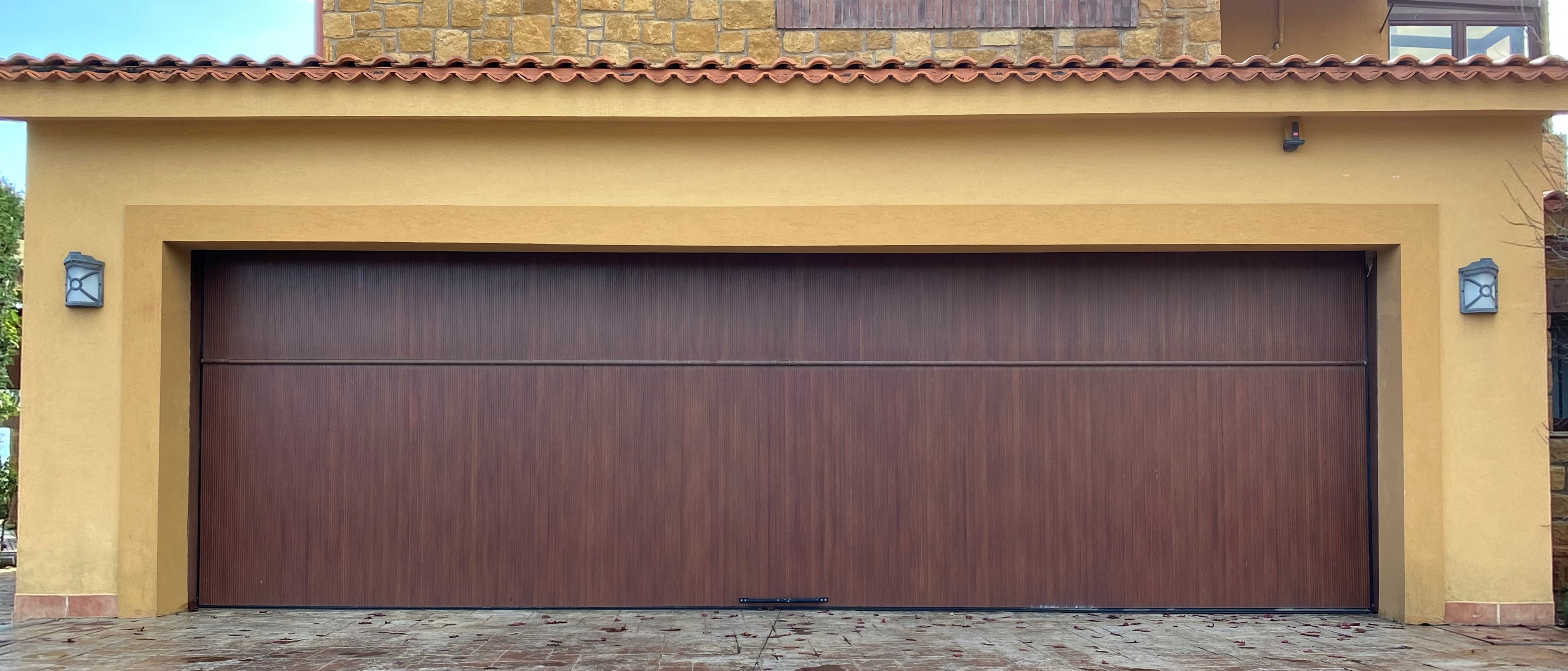 Wood-look aluminum cladded garage doors